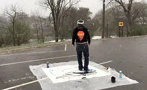 Artist Paints With His Feet While Viewing From An Overhead Drone With A Vr Helmet In A Snowstorm