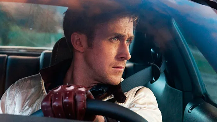 Scene from Drive movie showing a focused driver gripping the wheel, related to fun facts about movies.
