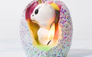 This Egg-Shaped Candle Contains A Baby Unicorn That's Ready To Hatch From Its Rainbow Lair