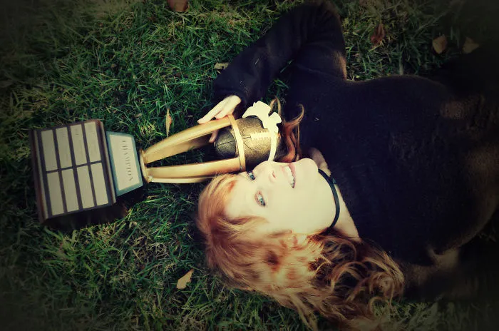 Woman Poses For Mommy-Baby Portraits With Fantasy Football Trophy