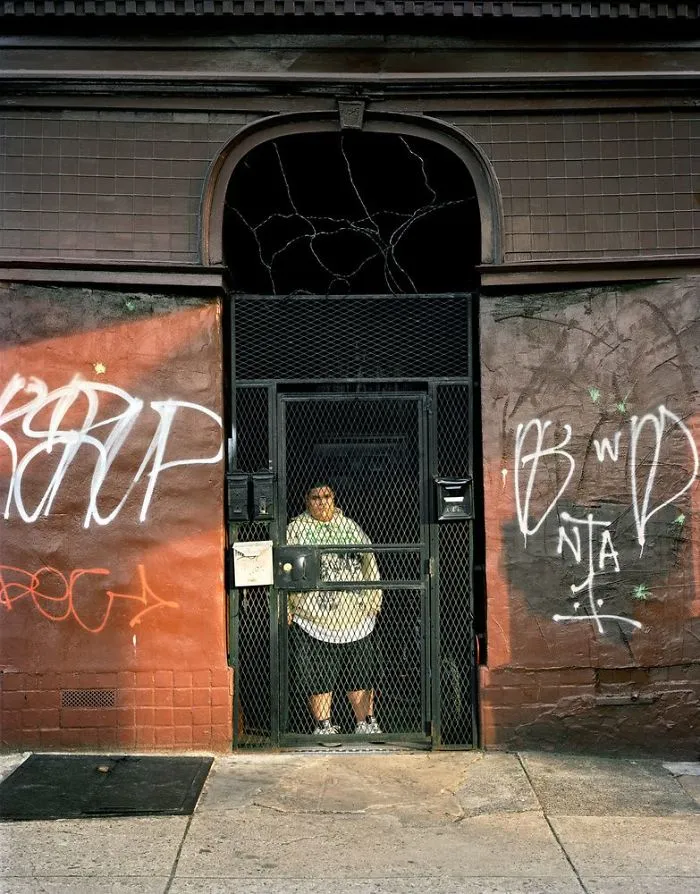 Photography of Christian behind a metal door