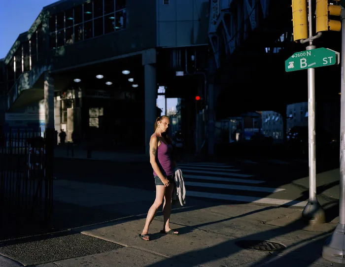 Photography of  a woman stands on Kensington Ave