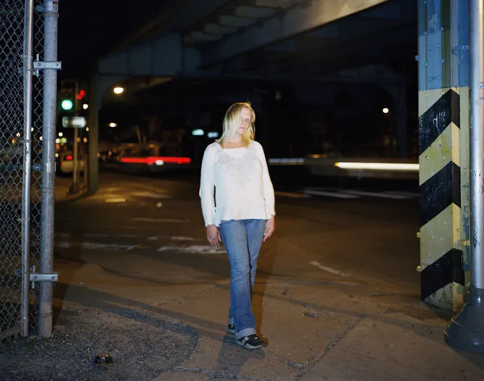 Portrait of Christina standing on the street