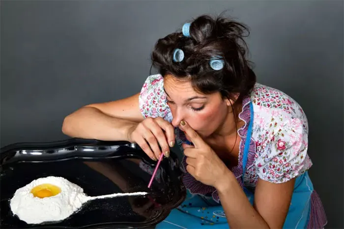 Woman sniffs the flour