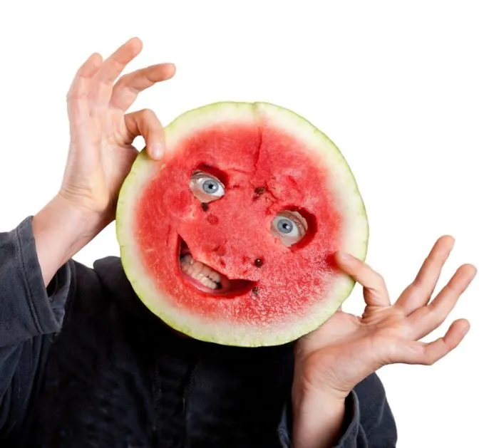 A man placed melon mask on his head