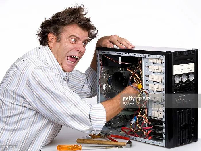 A crazy man opened the computer's insides and put an arm in it