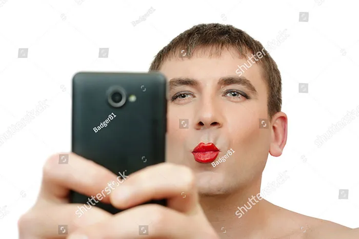 Man with a phone and red lipstick on