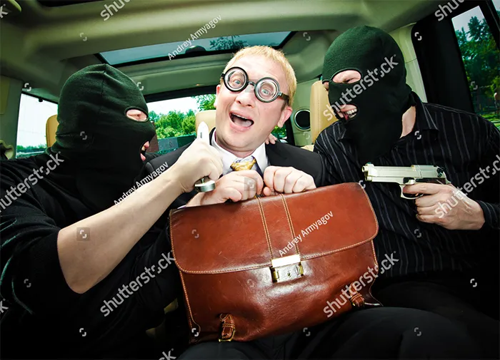 A man with a leather bag is kidnapped by two masked men with guns in car