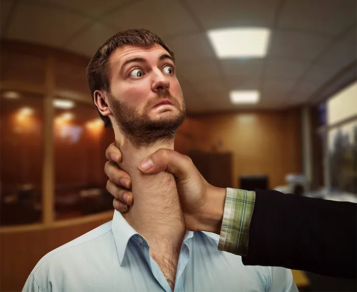 Man is grabbed by his neck, and it's stretched out