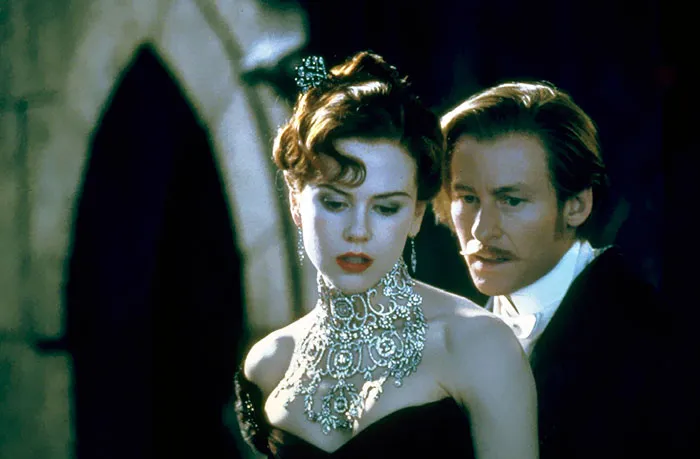 Scene from Moulin Rouge movie featuring two characters in vintage attire, illustrating fun facts about movies.