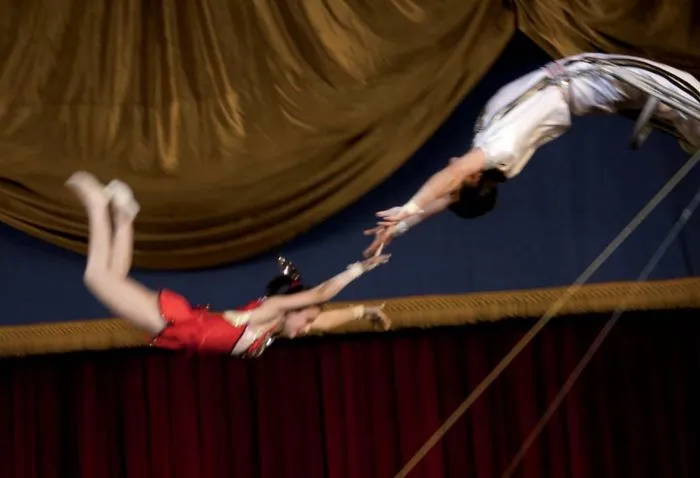 Acrobats performing a flip 