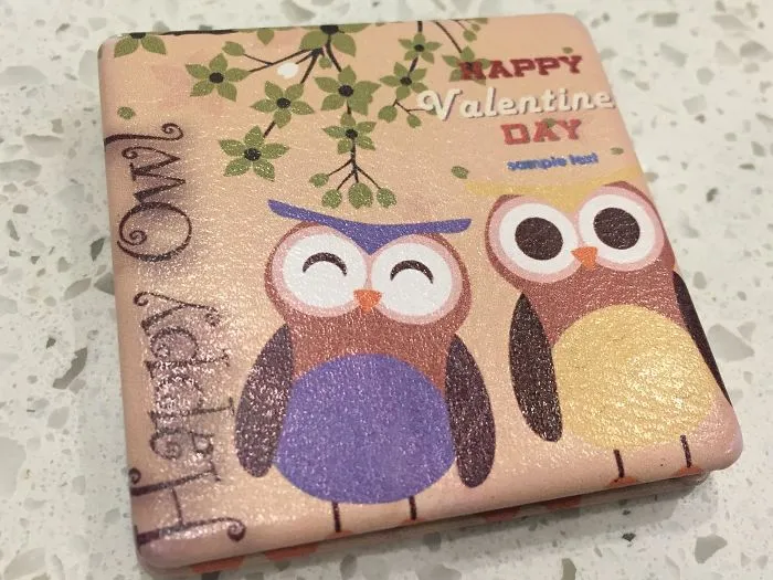 Cute owl-themed Valentine’s design fail on a pink greeting card.