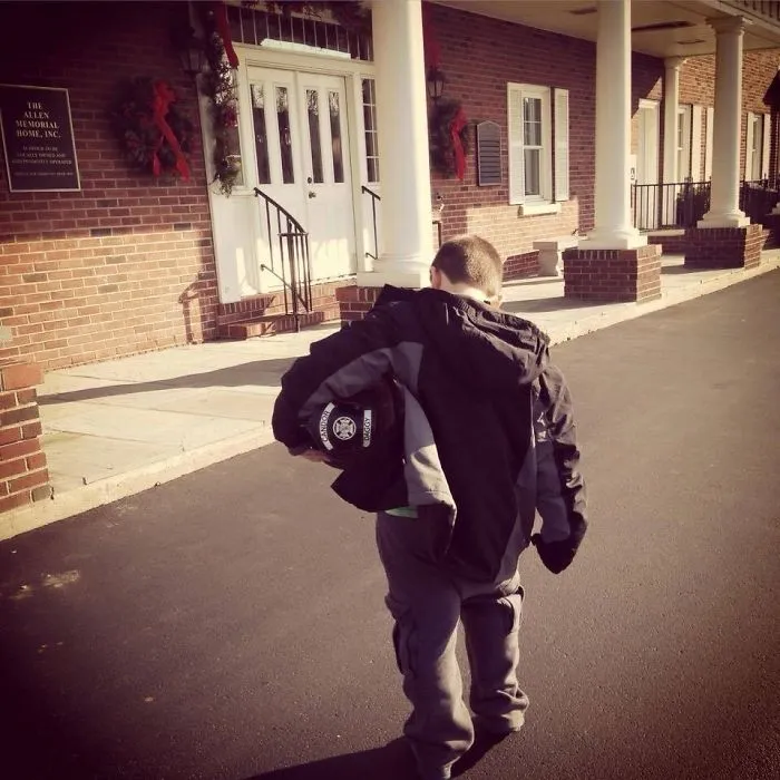 Firefighter From A Local Fire Department Passed Away Recently. His Wife Recently Posted This With The Caption: "The Moment You Realize Your 6-Year-Old Son Is Brave Enough To Deliver His Father's Fire Helmet To The Funeral Home"