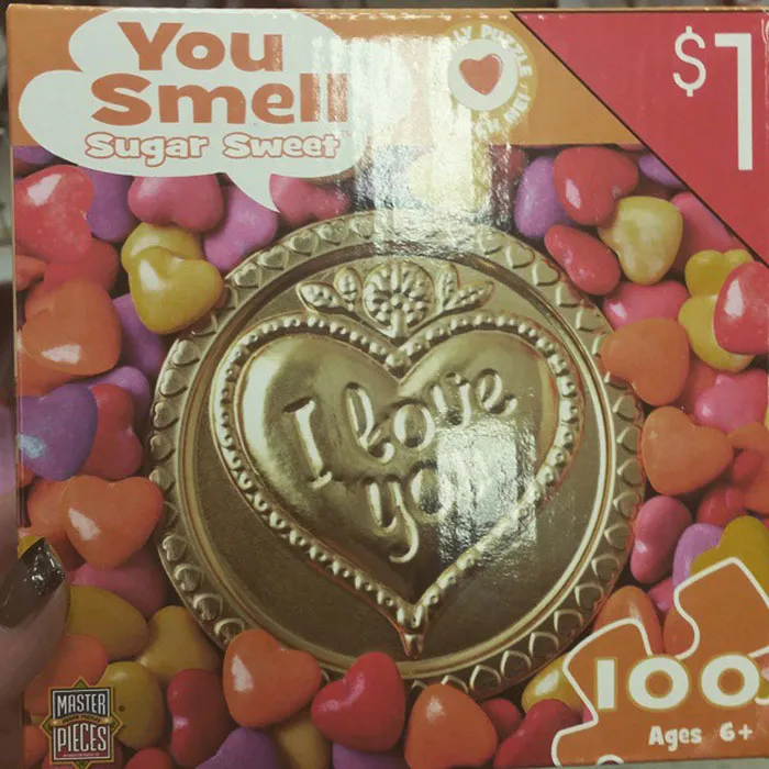 Valentine’s design fail: heart-shaped candy box labeled "You Smell Sugar Sweet."