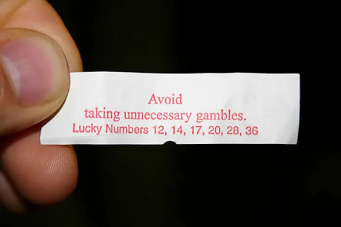 Fortune cookie saying: "Avoid taking unnecessary gambles." Lucky numbers displayed.