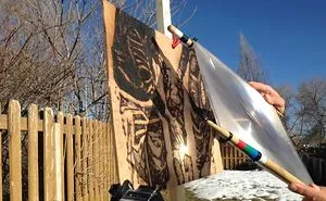 Artist Uses Sunlight To Burn Image Of Nephew Onto A Piece Of Wood
