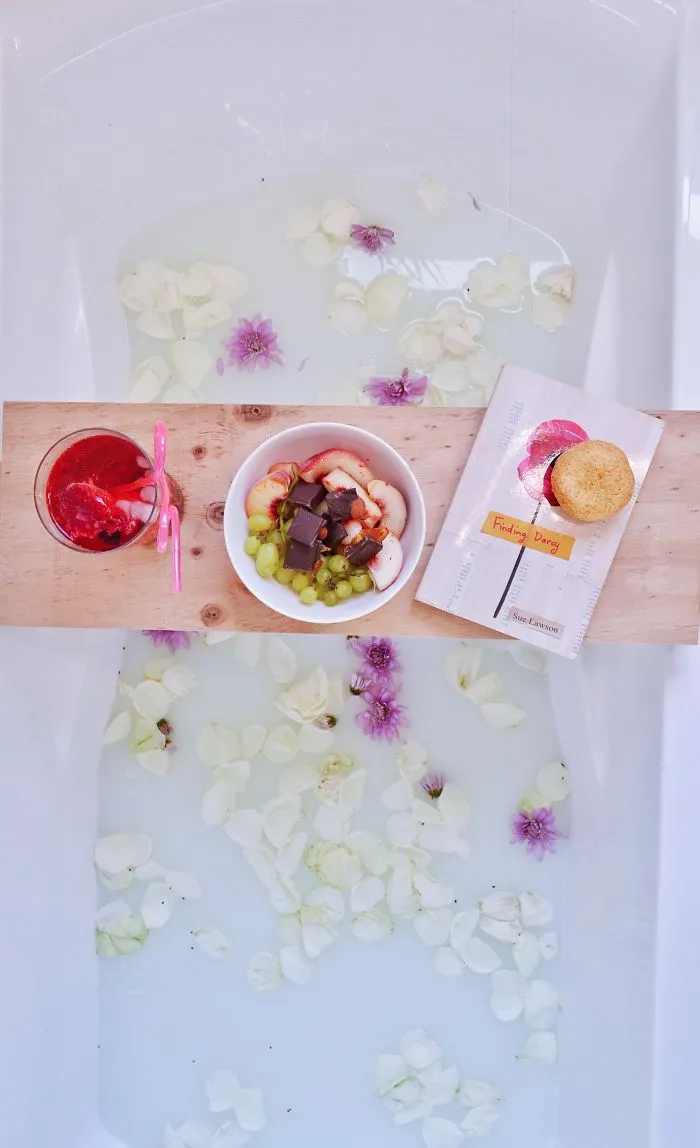 Why Read In Bed When You Can Soak In A Hot Bath With The Full Aroma Of Freshly Picked Flower Petals?
