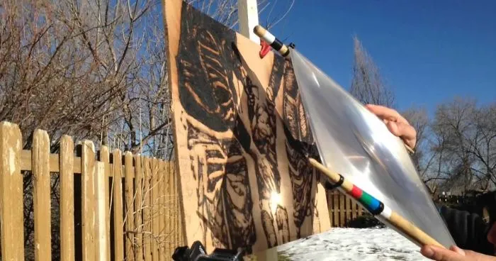 Artist Uses Sunlight To Burn Image Of Nephew Onto A Piece Of Wood