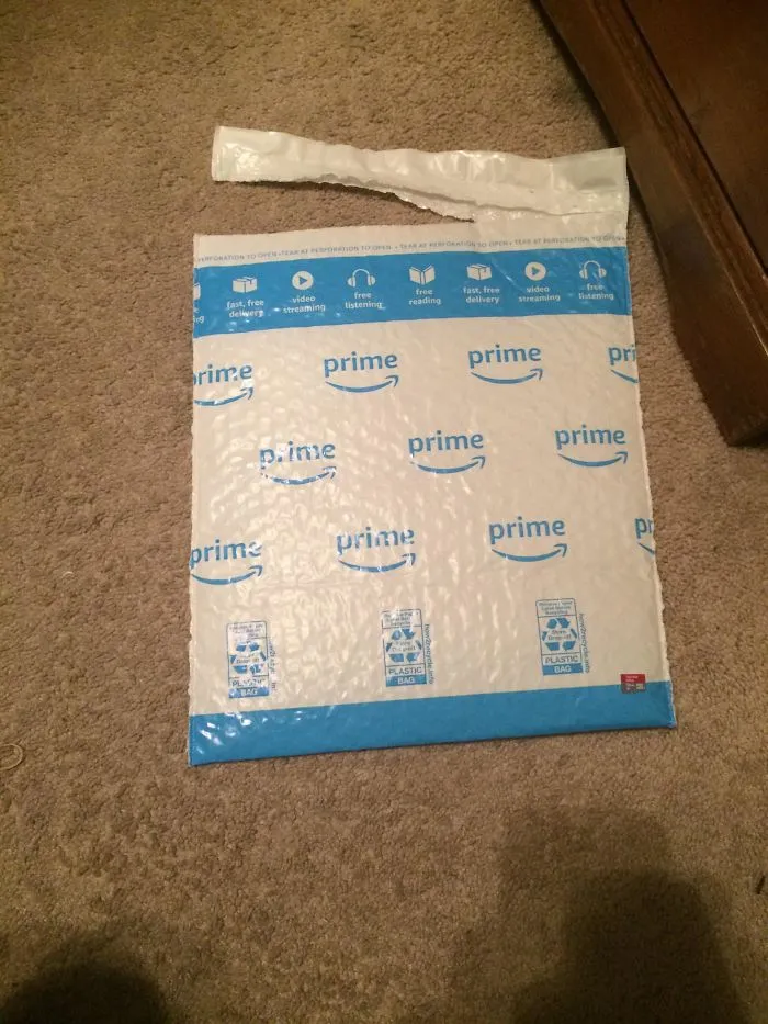They Sent Me This Tiny Micro SD Card (Red Thing On The Bottom Right) In This Huge Package. What A Waste Of Plastic