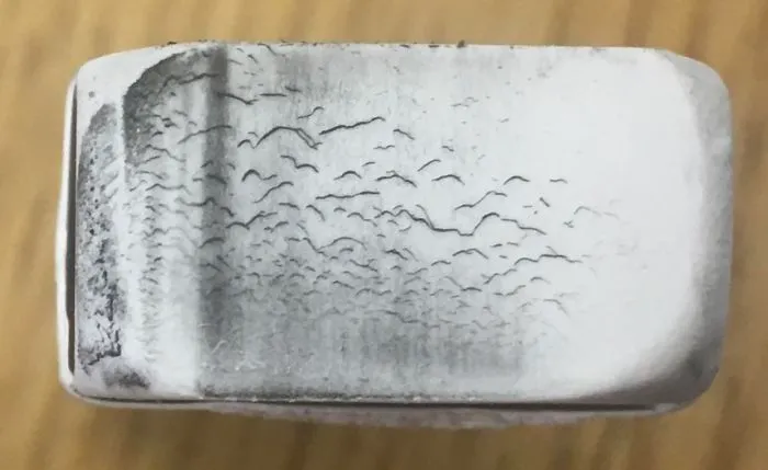 The Bottom Of My Eraser Looks Like A Painting Of Birds In Front Of A Row Of Trees