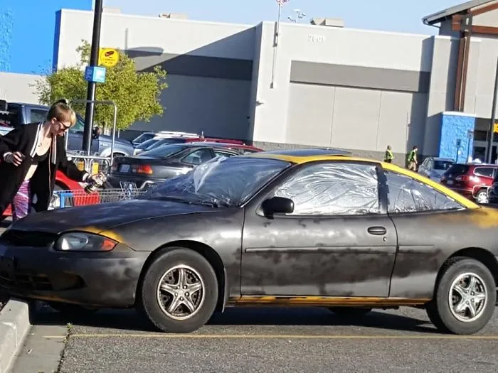 This Woman Was Spray-Painting Her Car Black In A Walmart Parking Lot On A Windy Day