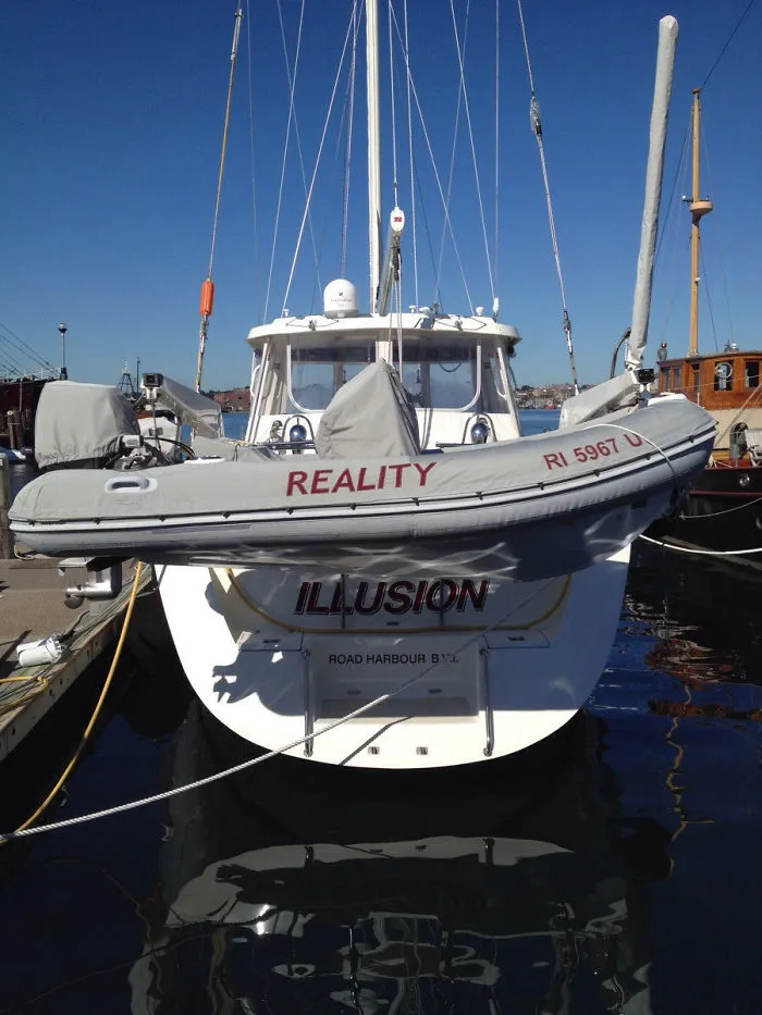 Funny named white boat and funnier named emergency boat 