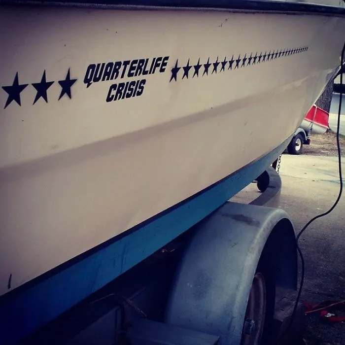 Funny named white boat in a trailer