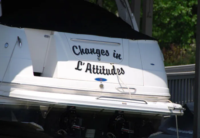Funny named white covered boat 