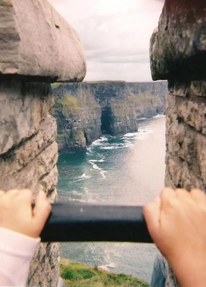 It Almost Looks Like They're Holding Up A Photograph