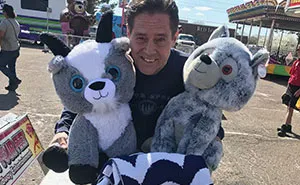My Dad Is So Amazing At Carnival Games, They Even Tried To Stop Him Playing