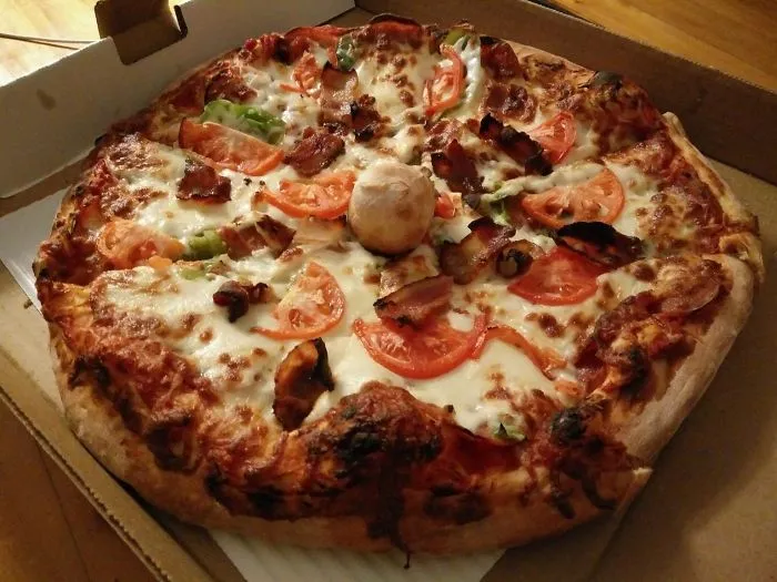 This Restaurant's 'Pizza Table' Is A Ball Of Dough