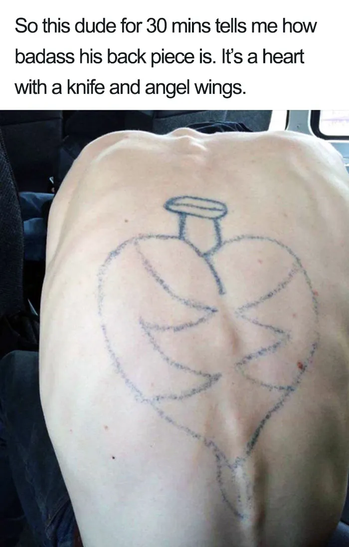 Back tattoo fail with a poorly drawn heart, knife, and angel wings.