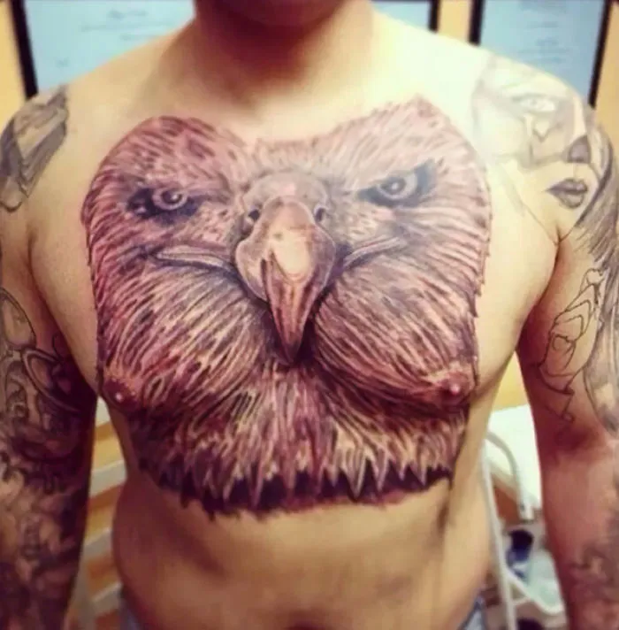 Chest tattoo fail featuring a large, detailed eagle design that looks awkward and humorous.