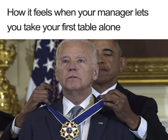 Restaurant meme showing a humorous medal-awarding moment, symbolizing taking on first table solo.