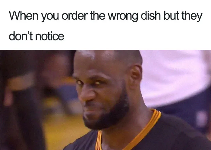 Close-up of a man smirking with text about ordering the wrong dish, related to hilarious restaurant memes.