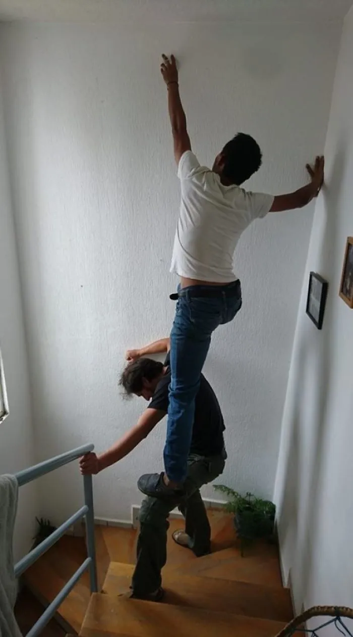 My Mate Changing A Light Bulb On His Coffee Shop. No Ladder Needed