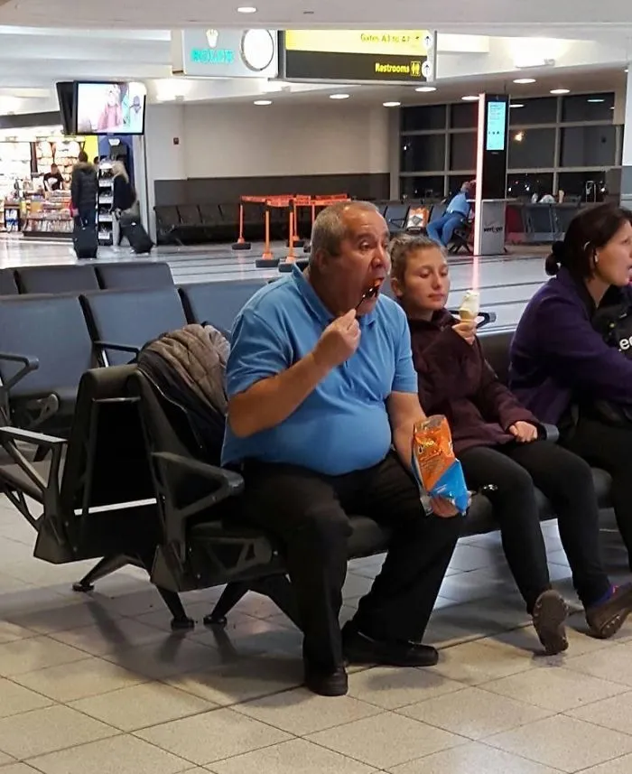 This Random Guy Eating A Bag Of Cheetos. With A Fork. At The Airport...