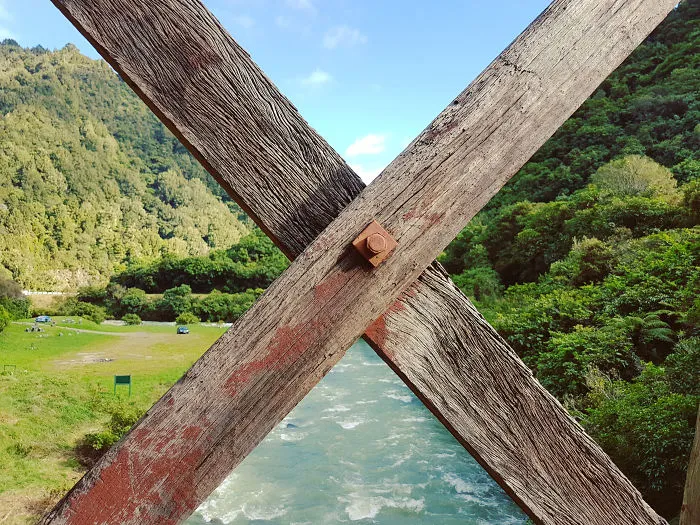 Landscape Perfectly Divided By The Rails Of A Fence