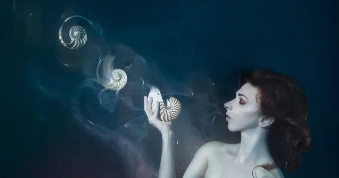 I Performed Underwater Holding Dissolving Shells To Convey The Effects Of Ocean Acidification
