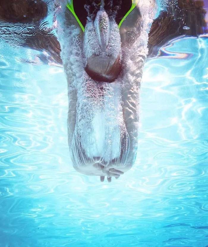 Springboard Diver Breaking The Surface