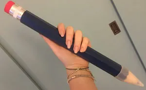 Woman Finally Finds Genius Way To Use Her GIANT Pencil She Got As Gift, And It's Hilariously Savage