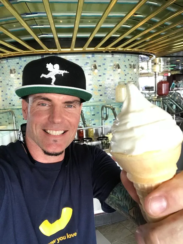 Vanilla Ice holding ice creams and smiling