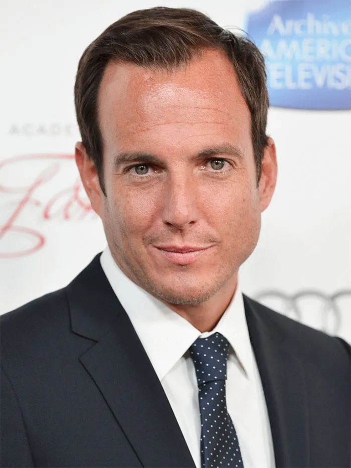 Will Arnett wearing suit and smiling