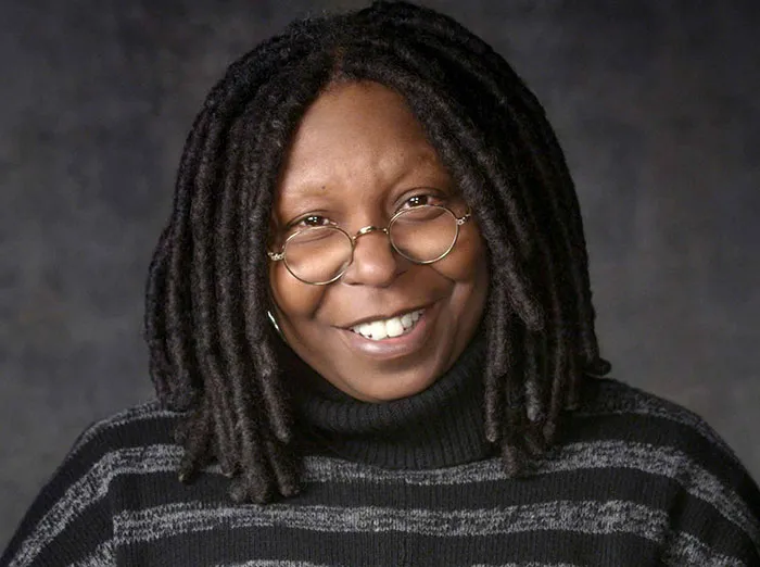 Whoopi Goldberg looking and smiling