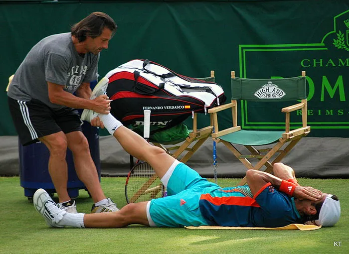 Man taking care of athlete