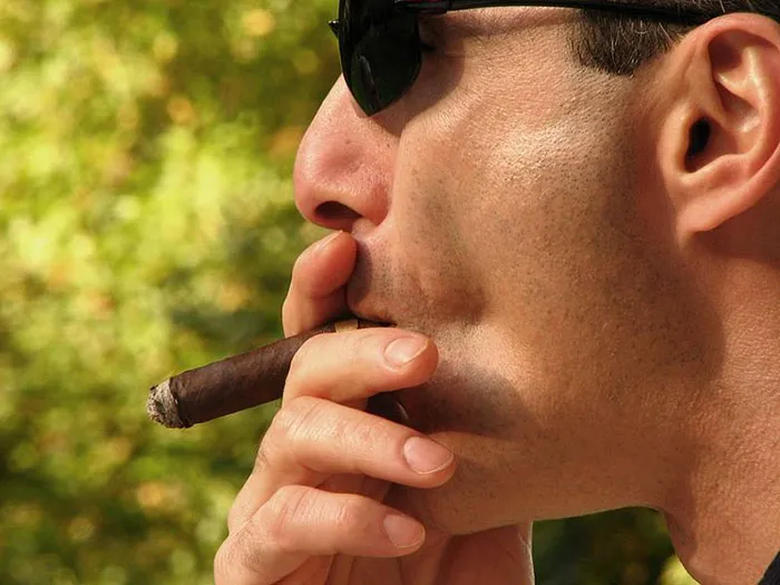 Man smoking cigar