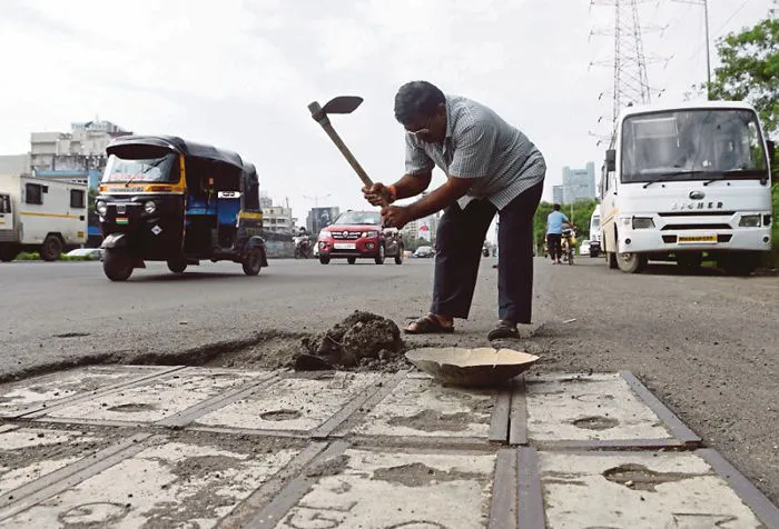Indian Man Fills Potholes Out Of Love For His Dead Son