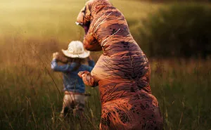Internet Is Laughing At These Family Pics After Mom Lets Autistic Son Wear T-Rex Suit As He Hates Being Photographed