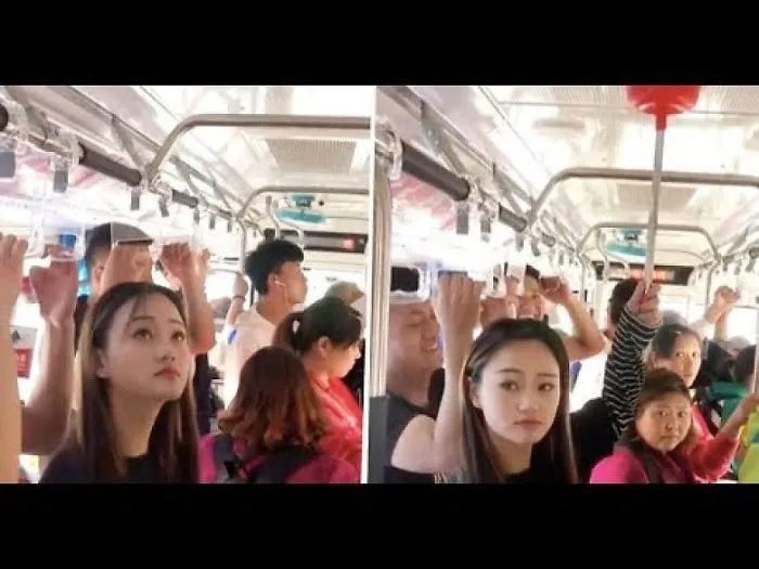 Woman Uses A Toilet Plunger As A Makeshift Handle On A Bus