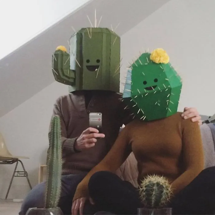 Cute couples Halloween costume ideas with a man and woman wearing homemade cardboard cactus heads
